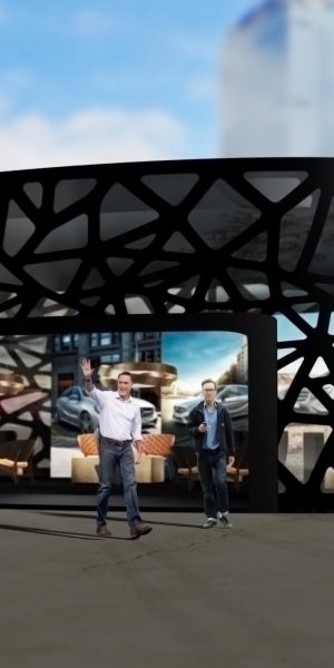 Messepavillon mit offener Front und futuristischem Design bei Tageslicht in urbaner Umgebung.