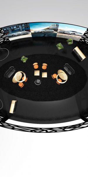 Obere Draufsicht eines runden, modernen Messebaustands mit schwarzen Gitterwänden und zentralem Loungebereich.